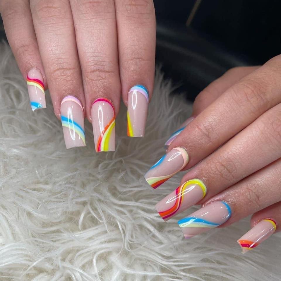 Nude nails with rainbow swirl lines